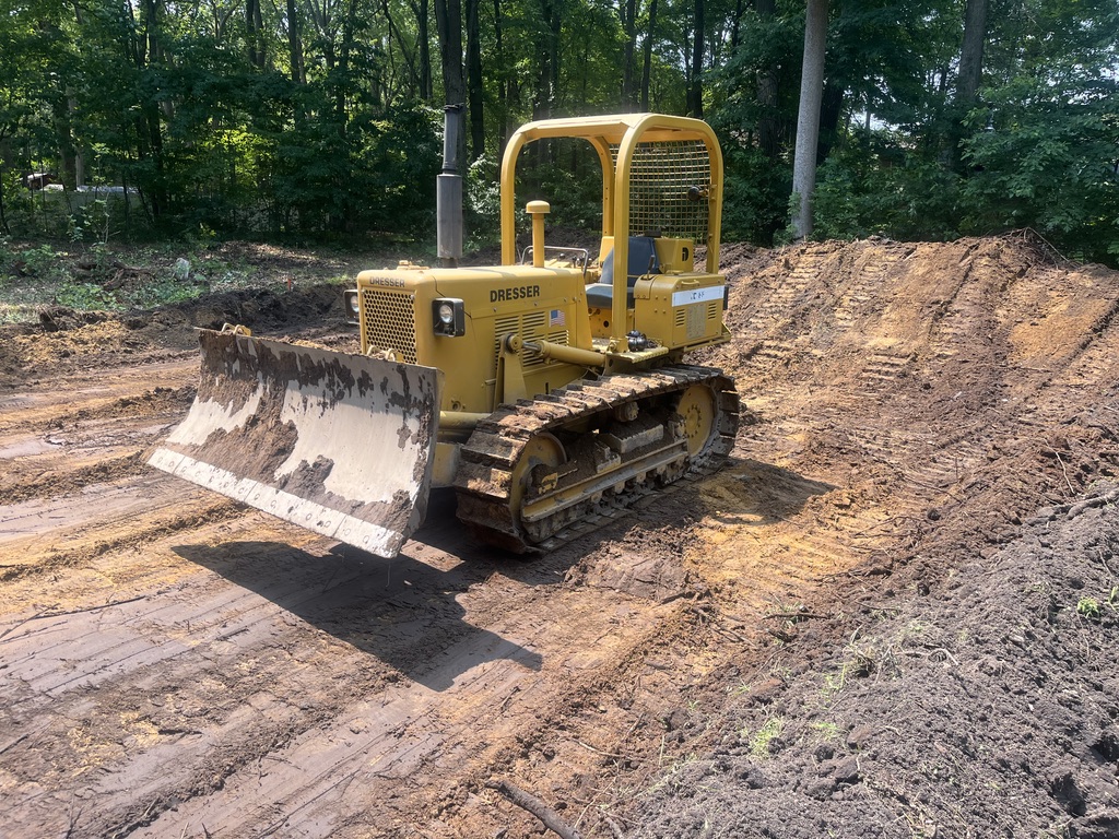 Dozer performing site work and excavation on a residential property