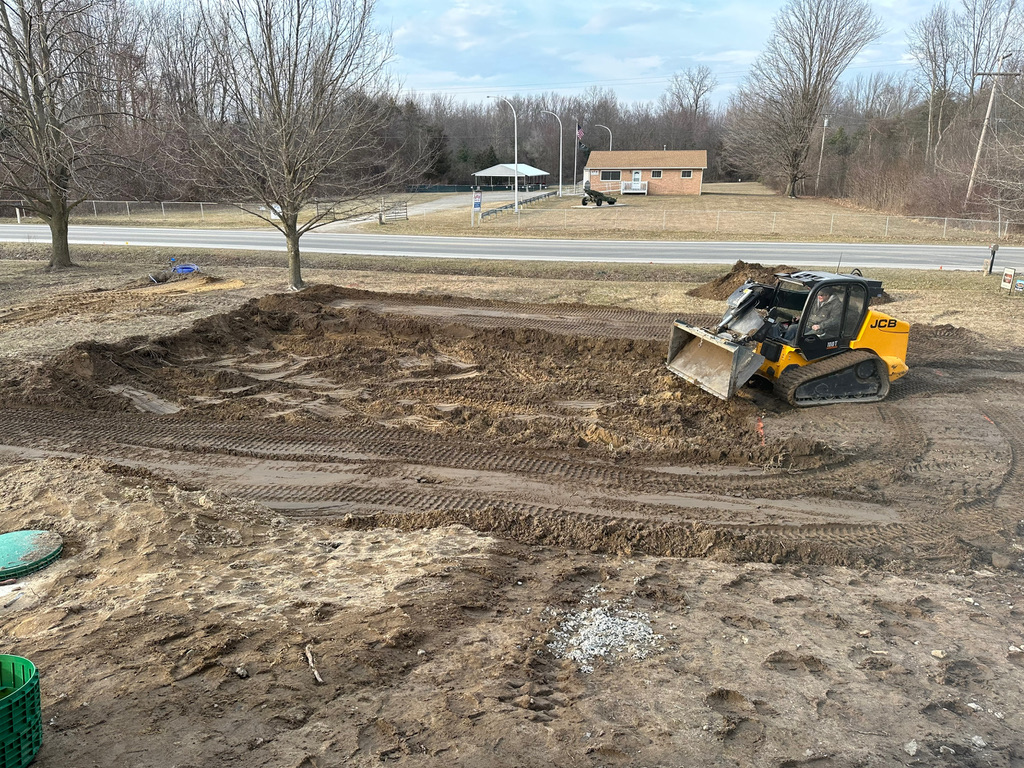 Residential excavation grading with skid steer